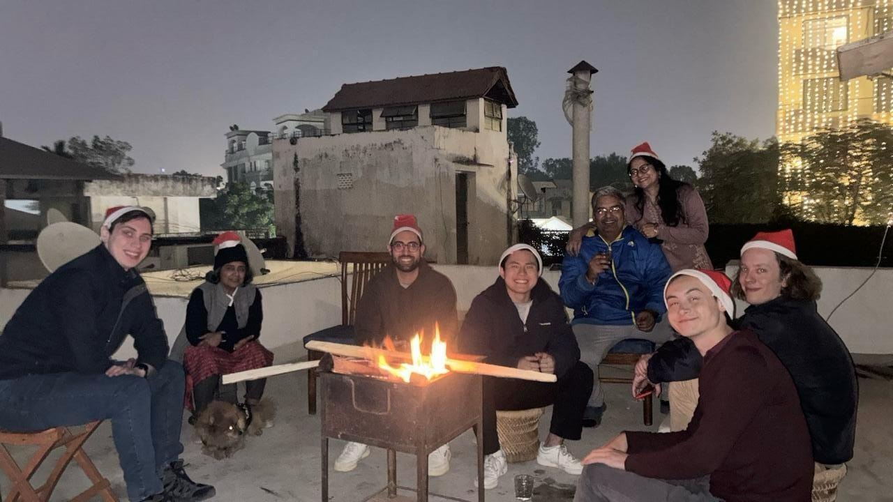 Christmas bonfire on the terrace with guests and hosts